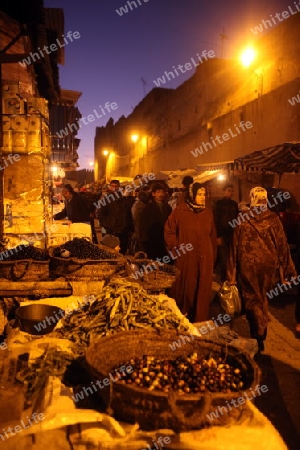 a smal Marketroad in the Medina of old City in the historical Town of Fes in Morocco in north Africa.