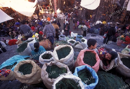 people in traditional clotes at the Market in the Village of  Chichi or Chichicastenango in Guatemala in central America.   