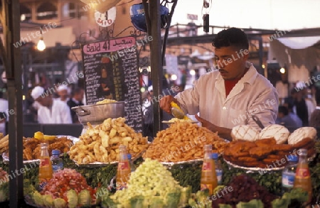 The Streetfood and Nightlife at the Djemma del Fna Square in the old town of Marrakesh in Morocco in North Africa.
