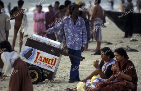Indian Tourists at the beach of Colva in the Province Goa in India.