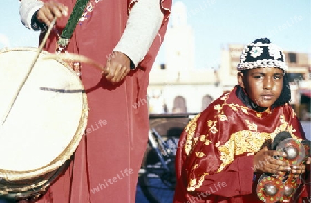 Traditional Music player at the Djemma del Fna Square in the old town of Marrakesh in Morocco in North Africa.
