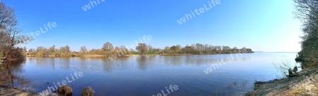 Beautiful high resolution panorama of a northern european country landscape with fields and green grass.