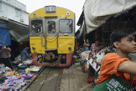 the Maeklong Railway Markt at the Maeklong railway station  near the city of Bangkok in Thailand in Suedostasien.