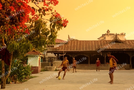 Young Monks Play Soccer in a Pagoda in the town of Nyaungshwe at the Inle Lake in the Shan State in the east of Myanmar in Southeastasia.