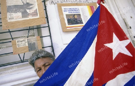 people in the streets in the city centre in the city of Santiago de Cuba on Cuba in the caribbean sea.