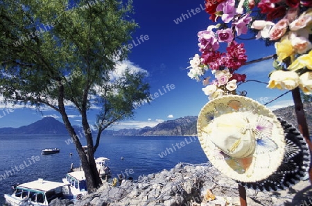 The Lake Atitlan mit the Volcanos of Toliman and San Pedro in the back at the Town of Panajachel in Guatemala in central America.   