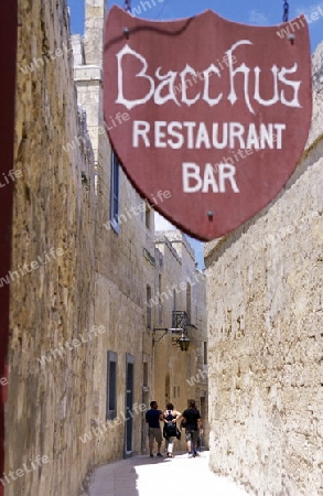 A smal road in the centre of the Old Town of the city of Valletta on the Island of Malta in the Mediterranean Sea in Europe.
