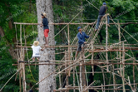 A construction for a traditional Woodhouse in the Angkor Thom  in the Temple City of Angkor near the City of Siem Riep in the west of Cambodia.