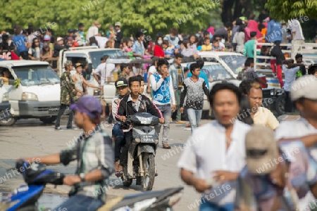 People at the Waterparty at the Thingyan Water Festival at the Myanmar New Year in the city centre of Mandalay in Manamar in Southeastasia.