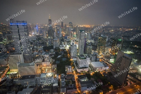 The Skyline view from the Sky Bar at the Riverside Aerea in the city of Bangkok in Thailand in Southeastasia.