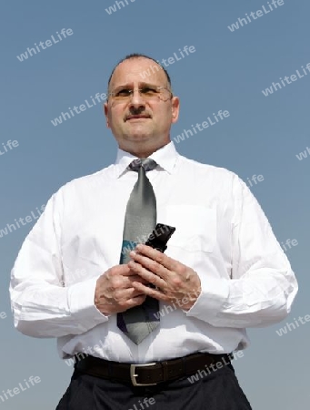 businessman hold a cellphone in his hands