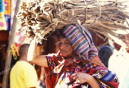 people in traditional clotes at the Market in the Village of  Chichi or Chichicastenango in Guatemala in central America.   