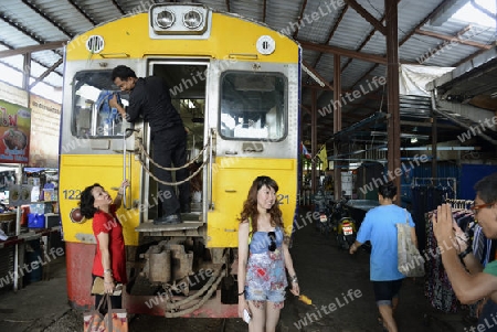 the Maeklong Railway Markt at the Maeklong railway station  near the city of Bangkok in Thailand in Suedostasien.