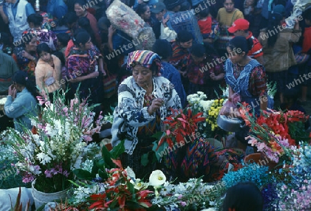 people in traditional clotes at the Market in the Village of  Chichi or Chichicastenango in Guatemala in central America.   