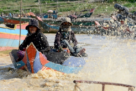 The People at wort in the Lake Village Kompong Pluk at the Lake Tonle Sap near the City of Siem Riep in the west of Cambodia.