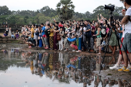 Tourists at the Angkor Wat in the Temple City of Angkor near the City of Siem Riep in the west of Cambodia.