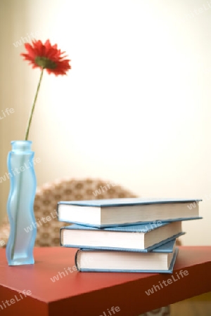 volumes on a red table