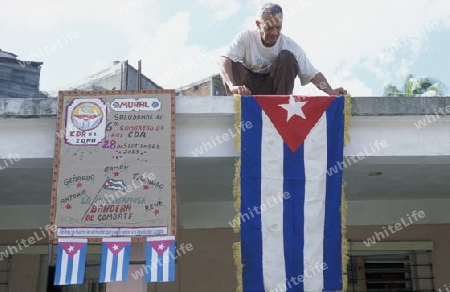 people in the streets in the city centre in the city of Santiago de Cuba on Cuba in the caribbean sea.