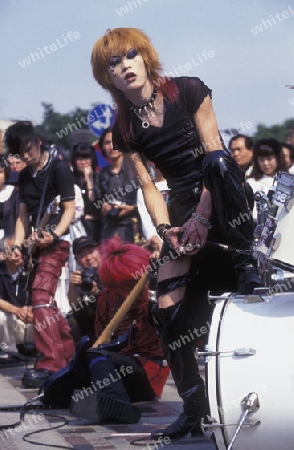 a Japanese Youth Punk Band plays on a square in the City of Tokyo in Japan in Asia,



