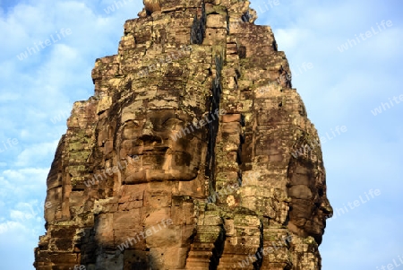 Stone Faces the Tempel Ruin of Angkor Thom in the Temple City of Angkor near the City of Siem Riep in the west of Cambodia.