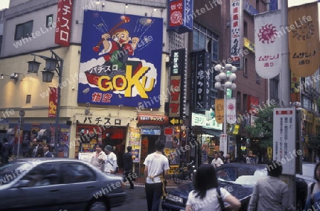 A Road with Shopping and Trafic in the City centre of Tokyo in Japan in Asia,




