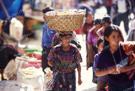 people in traditional clotes at the Market in the Village of  Chichi or Chichicastenango in Guatemala in central America.   