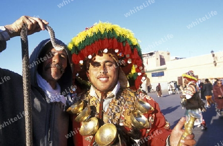 Traditional water seller at the Djemma del Fna Square in the old town of Marrakesh in Morocco in North Africa.
