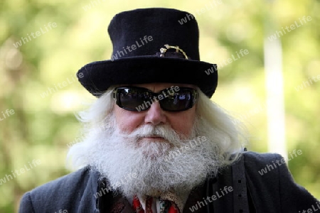 a men in traditional dress on a Summer Festival in a Parc in the old City of Vilnius in the Baltic State of Lithuania,  