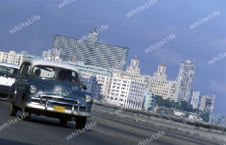 the Malecon road on the coast in the old townl of the city of Havana on Cuba in the caribbean sea