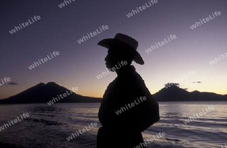 The Lake Atitlan mit the Volcanos of Toliman and San Pedro in the back at the Town of Panajachel in Guatemala in central America.   