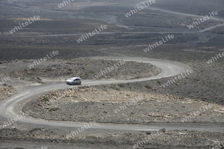 The Road in the Jandia Natural Parc on the south of the Island Fuerteventura on the Canary island of Spain in the Atlantic Ocean.