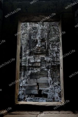 Stone Faces the Tempel Ruin of Angkor Thom in the Temple City of Angkor near the City of Siem Riep in the west of Cambodia.