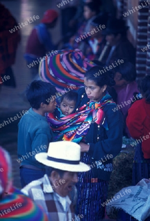 people in traditional clotes at the Market in the Village of  Chichi or Chichicastenango in Guatemala in central America.   