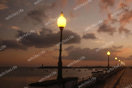 The promenade of the old town of the City of Arrecife on the Island of Lanzarote on the Canary Islands of Spain in the Atlantic Ocean. on the Island of Lanzarote on the Canary Islands of Spain in the Atlantic Ocean.
