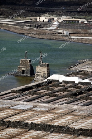 The Salinas in the Laguna of El Charco on the Island of Lanzarote on the Canary Islands of Spain in the Atlantic Ocean.