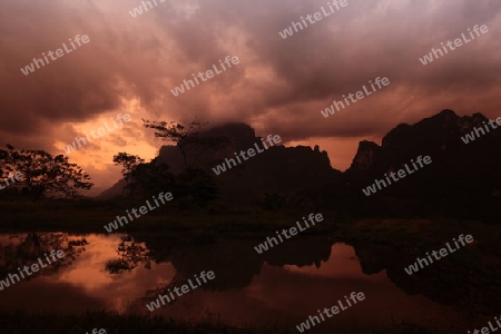 Die Landschaft in der Bergregion beim Dorf Kasi an der Nationalstrasse 13 zwischen Vang Vieng und Luang Prabang in Zentrallaos von Laos in Suedostasien