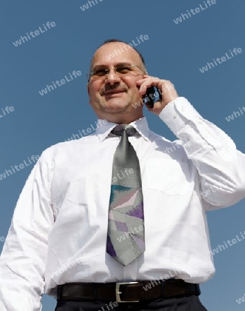 businessman talking with a smile in his face