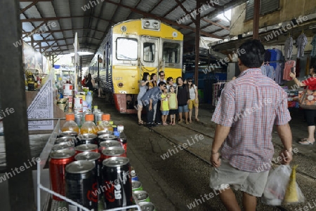 the Maeklong Railway Markt at the Maeklong railway station  near the city of Bangkok in Thailand in Suedostasien.