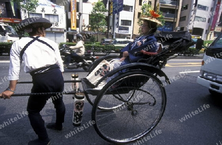 a Riksha at the big Festival in the Asakusa Senso Ji Tempel in the city centre of Tokyo in Japan in Asia,



