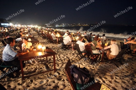 Ein Strand in Jimbaran Beach im Sueden der Insel Bali in Indonesien in Suedostasien.