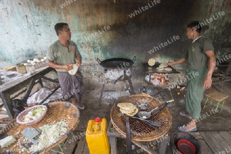 a Restaurant near the Town of Myingyan southwest of Mandalay in Myanmar in Southeastasia.