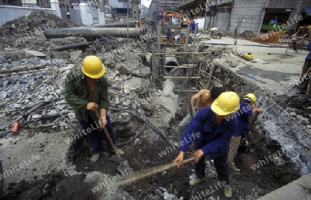  working people in the construction in the City of Shanghai in china in east asia. 