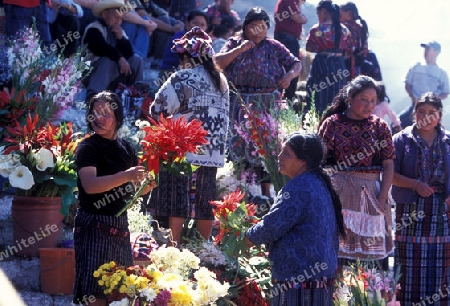 people in traditional clotes at the Market in the Village of  Chichi or Chichicastenango in Guatemala in central America.   