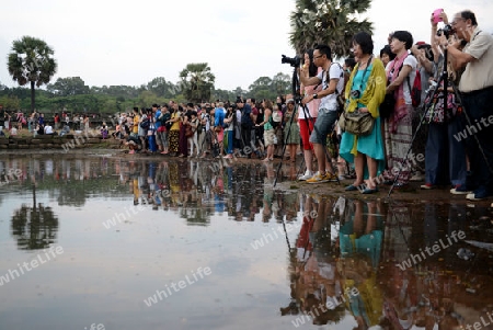 Tourists at the Angkor Wat in the Temple City of Angkor near the City of Siem Riep in the west of Cambodia.