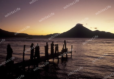 The Lake Atitlan mit the Volcanos of Toliman and San Pedro in the back at the Town of Panajachel in Guatemala in central America.   