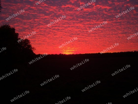 Wolkenspiel im Sonnenuntergang