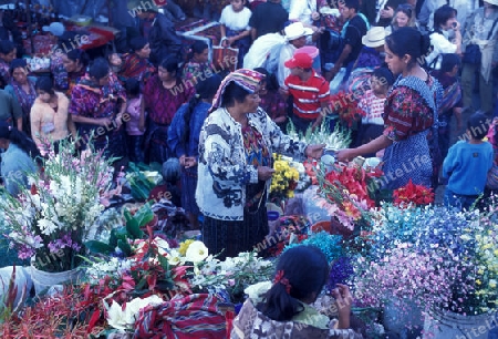 people in traditional clotes at the Market in the Village of  Chichi or Chichicastenango in Guatemala in central America.   