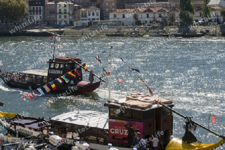 a boat on the Douro River in Ribeira in the city centre of Porto in Porugal in Europe.