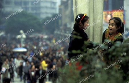 People at the main square in the city of Chongqing in the province of Sichuan in china in east asia. 