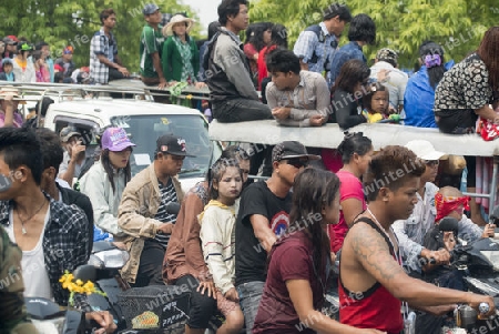 People at the Waterparty at the Thingyan Water Festival at the Myanmar New Year in the city centre of Mandalay in Manamar in Southeastasia.